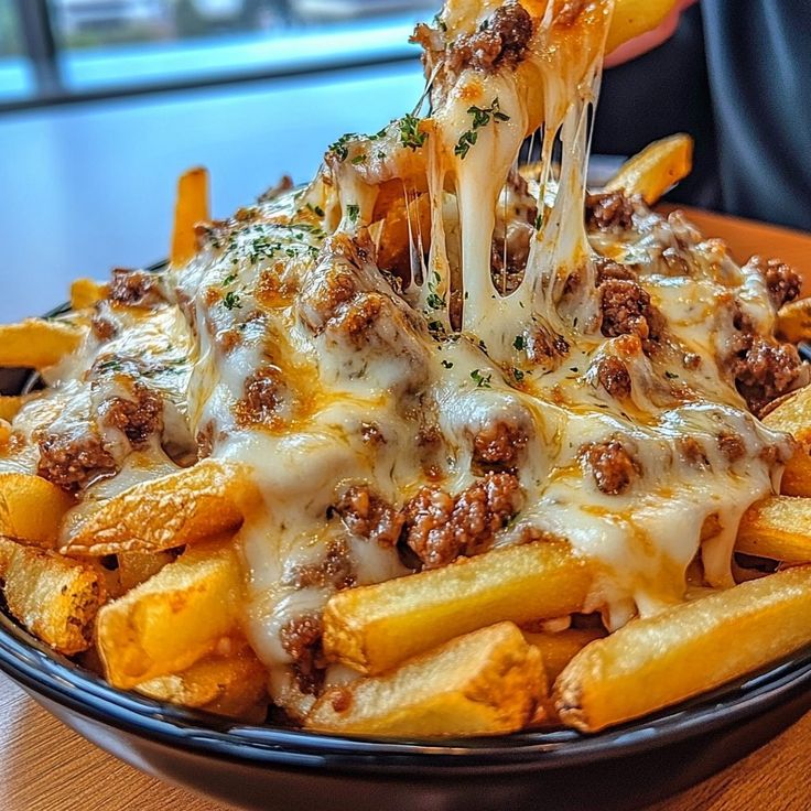 Loaded fries topped with beef and melted mozzarella